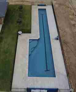 2023 SPASA award-winning vinyl-lined lap pool by Add A Splash Pools, perfect for competitive swimming training and family enjoyment during hot WA summers, featuring T-end lap lane markers and 25m of freshwater swimming space.