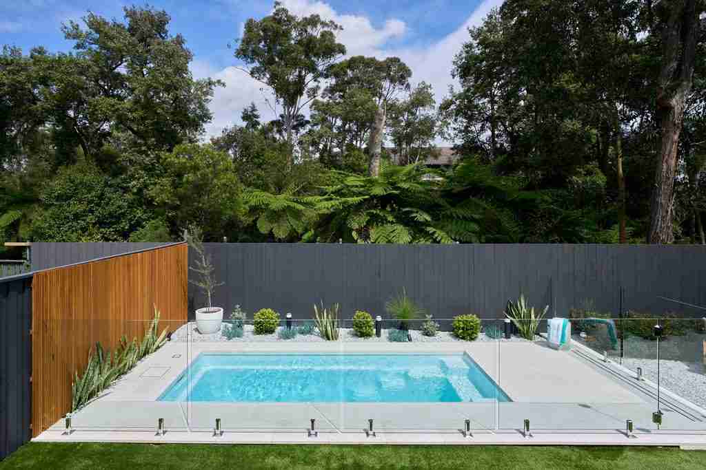 2023 NSW Best Fibreglass Pool award winner by Narellan Pools Hills District, featuring the Eden Slimline 5 in Whitehaven Pearl, a perfect backyard oasis for relaxation and family memories