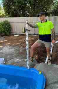 2023 SPASA award winner, Rainwise Pools Adelaide's construction tradesperson Harrison, demonstrating outstanding work ethic and precise workmanship in swimming pool installation, optimising customer satisfaction in poolquotes.com.au feature.